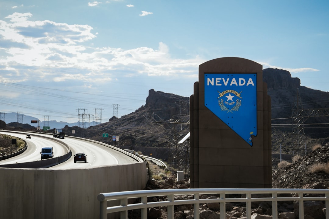 A photo of a Nevada hillside home site showing grading, excavation, and retaining wall work in progress
